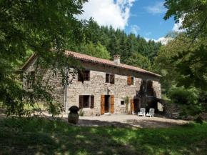 Beautiful stone farmhouse in mountain forest setting